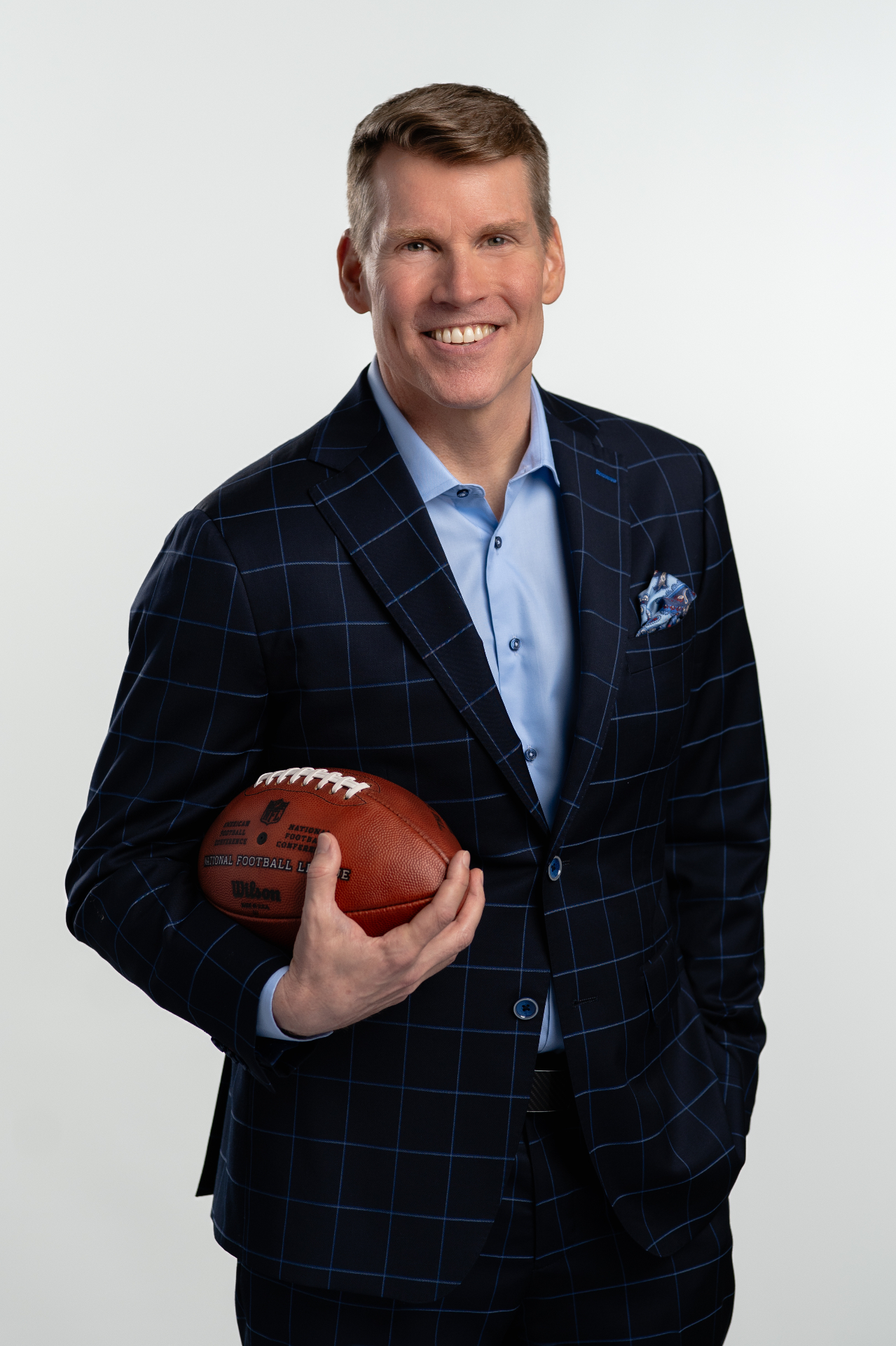 Executive portrait with football