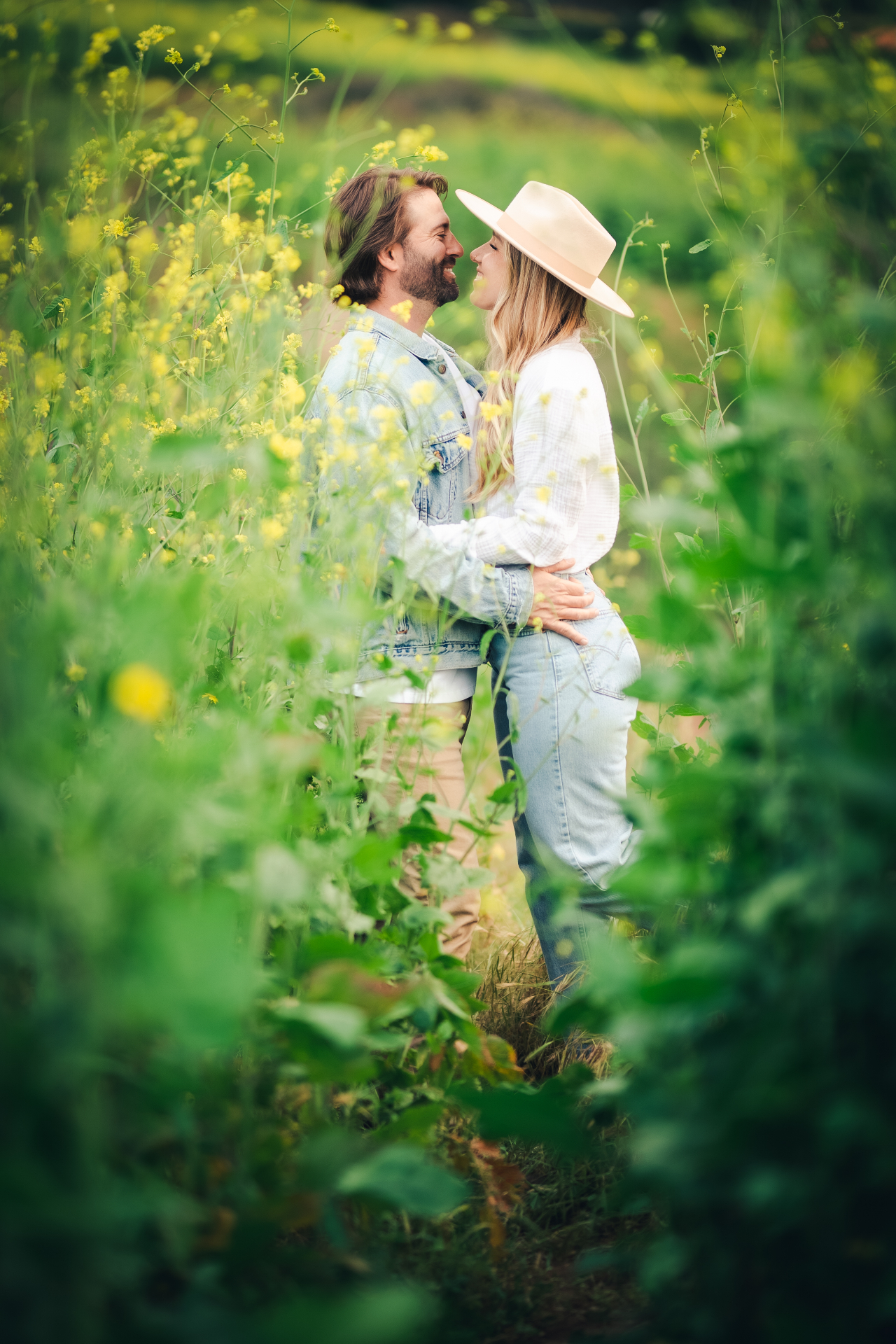 Couple embracing in a wildflower field